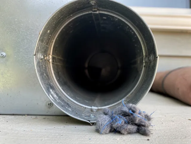 Macedonia Dryer Vent Cleaning technician using specialized equipment to clear severe dryer vent blockage in Macedonia
